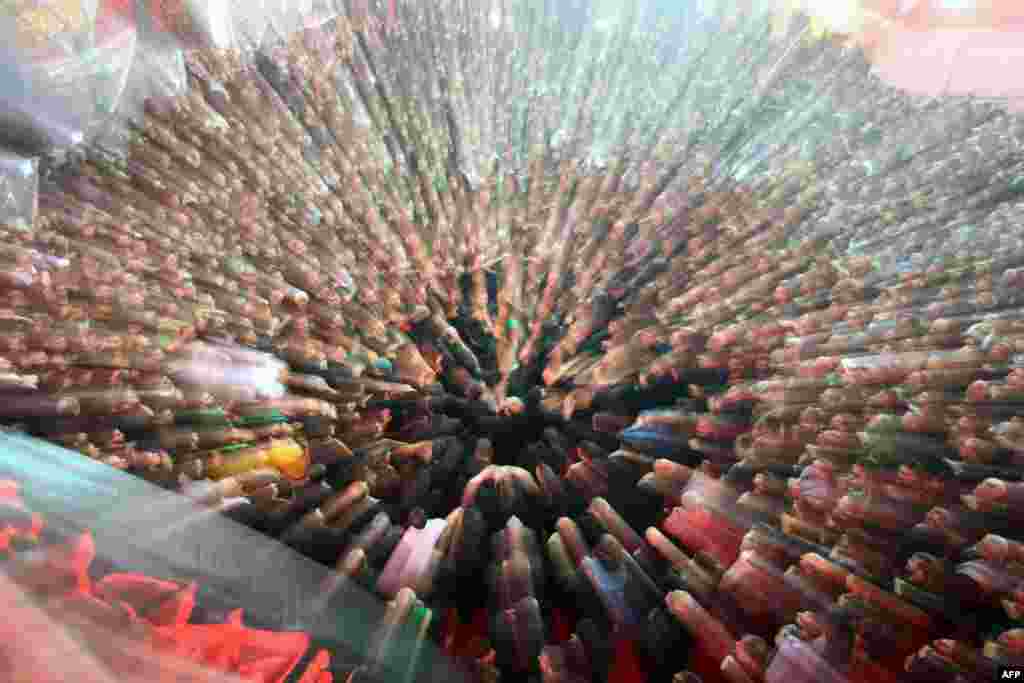 Shiite Muslim worshiper beat themselves at the shrine of Imam Abbas to commemorate Ashura in Karbala, 50 miles (80 kilometers) south of Baghdad, Iraq.