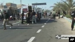 An ambulance attends the scene of a bomb blast in this image taken from TV, in Chahbahar, Iran, 15 Dec 2010