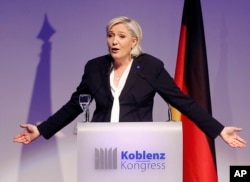 FILE - Far-right leader and candidate for next spring presidential elections Marine le Pen from France delivers a speech in Koblenz, Germany, Jan. 21, 2017.