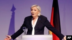FILE - Far-right leader and candidate for next spring presidential elections Marine le Pen from France delivers a speech in Koblenz, Germany.