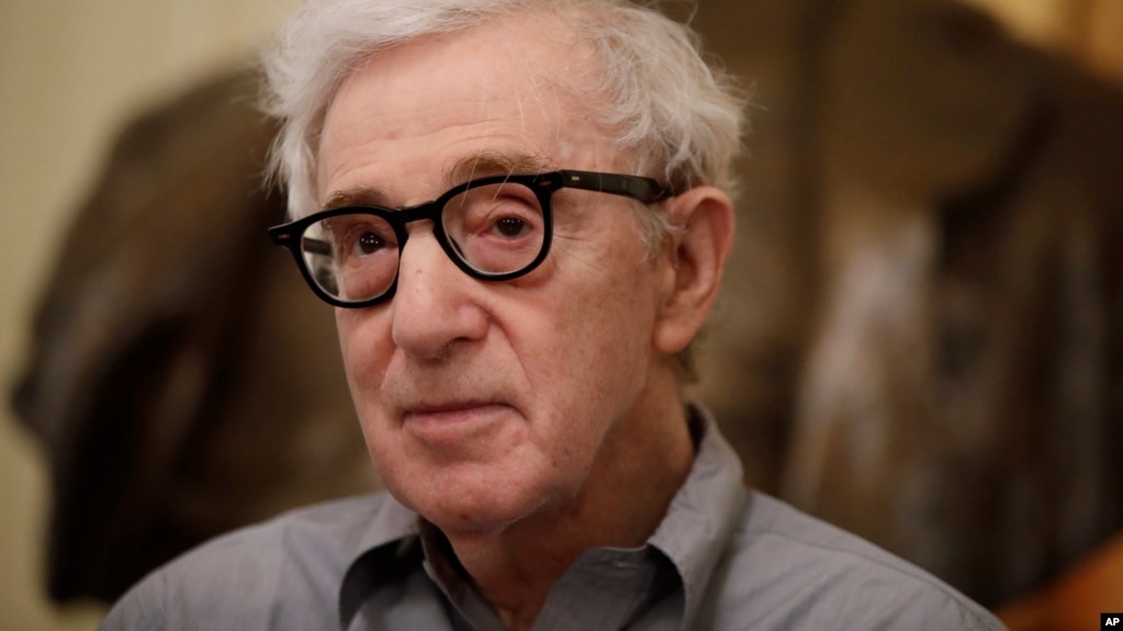 FILE - In this Tuesday, July 2, 2019 file photo, director Woody Allen attends a press conference at La Scala opera house, in Milan, Italy. The filmmaker had sued Amazon after the online giant ended his contract without ever releasing a completed film, "A Rainy Day in New York."