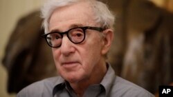 FILE - In this Tuesday, July 2, 2019 file photo, director Woody Allen attends a press conference at La Scala opera house, in Milan, Italy. The filmmaker had sued Amazon after the online giant ended his contract without ever releasing a completed film, "A Rainy Day in New York."