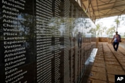 The names of those who were slaughtered as they sought refuge in the church, many with the same surname indicating a family, are written on a memorial to the thousands who were killed in the 1994 genocide in Rwanda.