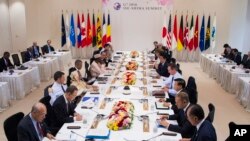 Leaders attend the the first Outreach Session during the final day of the Group of Seven summit meetings in Ise, Japan, Friday, May 27, 2016.