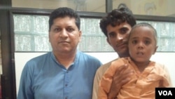 Hussain and his father, Haneef pictured with Dr. Asim Qidwai