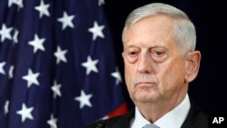 FILE - Defense Secretary James Mattis attends a news conference, Thursday, Aug. 17, 2017, at the State Department in Washington. 