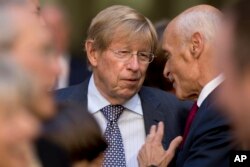 FILE - Former U.S. Solicitor General Ted Olson, center, speaks with former Homeland Security Secretary Michael Chertoff, right, before an installation ceremony for FBI Director Chris Wray at the FBI Building, Sept. 28, 2017, in Washington. Olson will offer testimony during Supreme Court confirmation hearings for Brett Kavanaugh.