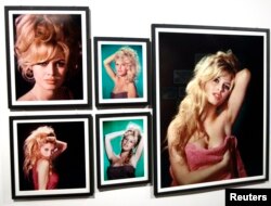 FILE - Pictures of former actress Brigitte Bardot are displayed during a media preview of an exhibition in Boulogne-Billancourt, western Paris, Sept. 25, 2009.