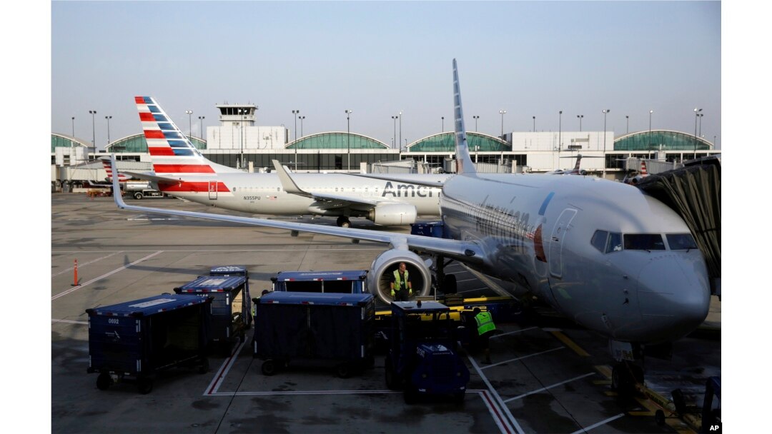In this June 16, 2018 photo, American Airlines jets are shown at O"Hare International Airport in Chicago.