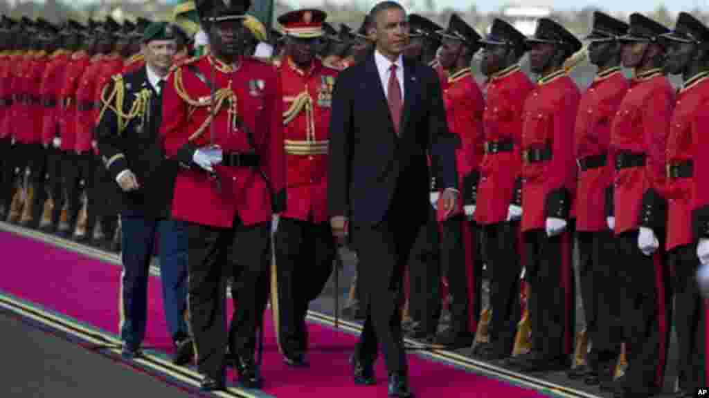 President Obama inspects the troops during an arrival ceremony in Dar Es Salaam, Tanzania.