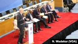 U.S. Ambassador to Kenya Robert Godec addresses the delegation in Nairobi, Kenya, and introduces President Uhuru Kenyatta, third from left.