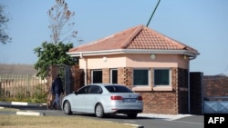 FILE - A car carrying elders of the Mandela family is seen outside the former state president's home in Qunu on June 25, 2013. 