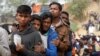 FILE - Rohingya refugees line up for a daily essentials distribution at Balukhali camp, near Cox's Bazar, Bangladesh, Jan. 15, 2018. 