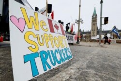 A protest sign is seen on Parliament Hill, as demonstrations by truckers and their supporters against the COVID-19 vaccine mandates continue, in Ottawa, Ontario, Canada, Jan. 31, 2022.