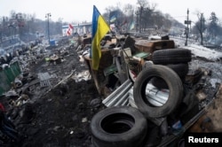Barricades built at the site of recent clashes with riot police are seen in Kyiv, Ukraine, Feb. 13, 2014.