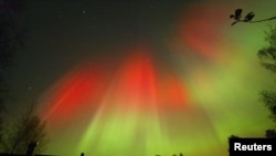 The aurora borealis is seen over the town of Hyvinkaa in southern Finland October 31, 2003.
