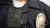 FILE - A Los Angeles police officer is shown wearing an on-body camera during a demonstration for media in Los Angeles. Thousands of police agencies have equipped officers with cameras to wear with their uniforms.