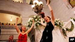 Margaret Miles, right, celebrates with wife Cathy ten Broeke, left, after they were married at the Minneapolis Freedom to Marry Celebration and Weddings, Aug. 1, 2013 at the Minneapolis City Hall.