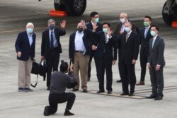 From left, former U.S. senator Chris Dodd, former U.S. Deputies Secretary of State James Steinberg and Richard Armitage have their photo taken with Taiwan Foreign Minister Joseph Wu upon arrival in Taipei, Taiwan on Wednesday, April 14, 2021. (Pool Photo