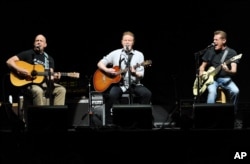 FILE - Eagles members Bernie Leadon (L) Don Henley and Glenn Frey (R)