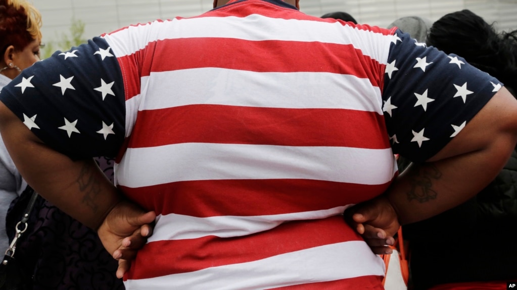 FILE - In this May 8, 2014, file photo, an overweight person is seen in New York. As obesity rates climb in the U.S., more Americans say they’re following special diets compared to a decade ago. (AP Photo/Mark Lennihan, File)