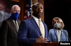 U.S. Senator Tim Scott (R-SC) is flanked by Senators Shelley Moore Capito (R-WV) and John Cornyn (R-TX) as he speaks about his new police reform bill unveiled by Senate Republicans during a news conference on Capitol Hill in Washington, June 17.