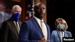 U.S. Senator Tim Scott (R-SC) is flanked by Senators Shelley Moore Capito (R-WV) and John Cornyn (R-TX) as he speaks about his new police reform bill unveiled by Senate Republicans during a news conference on Capitol Hill in Washington, June 17.