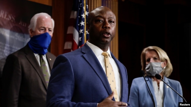 U.S. Senator Tim Scott (R-SC) is flanked by Senators Shelley Moore Capito (R-WV) and John Cornyn (R-TX) as he speaks about his new police reform bill unveiled by Senate Republicans during a news conference on Capitol Hill in Washington, June 17.