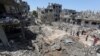 Maisons détruites à la suite des frappes aériennes et d'artillerie israéliennes alors que la violence transfrontalière entre l'armée israélienne et les militants palestiniens se poursuit, dans le nord de la bande de Gaza, le 14 mai 2021.