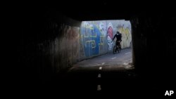 A commuter cycles along an empty street on the city&#39;s annual car-free day in Bogota, Colombia.