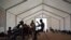 FILE - Sierra Leone migrants who were expelled from Algeria wait for repatriation in an International Organization for Migration center in Agadez, Niger, June 5, 2018.
