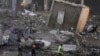 Rescuers check a building hit by an Israeli airstrike in Chiyah, a southern suburb of Beirut, Lebanon, on Nov. 22, 2024.