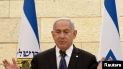 Israeli Prime Minister Benjamin Netanyahu speaks at a ceremony for fallen soldiers of Israel's wars at the Yad Lebanim House on the eve of Memorial Day, in Jerusalem, April 13, 2021.