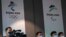 Reporters are seen in front of the Beijing 2022 Winter Olympic and Paralympic Games signs during a news conference on the construction progress of the sports event venues, at the headquarters of the Beijing Organising Committee, in Beijing, China July 30…