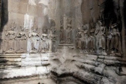 This July 19, 2012, photo shows the Apsara sculptures carved on a wall of the Angkor Wat temple complex in Siem Reap, northwest of Phnom Penh, Cambodia.