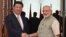 FILE - Indian Prime Minister Narendra Modi, right, shakes hand with Chinese President Xi Jinping as he welcomes him at a hotel in Ahmadabad, India, Sept. 7, 2014. The two leaders will meet April 27-28, 2018, for a visit that some experts have described as a possible way to reset a complicated relationship between the two Asian powers.