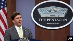 FILE - U.S. Secretary of Defense Mark Esper speak during a news conference at the Pentagon in Washington, Jan. 27, 2020.