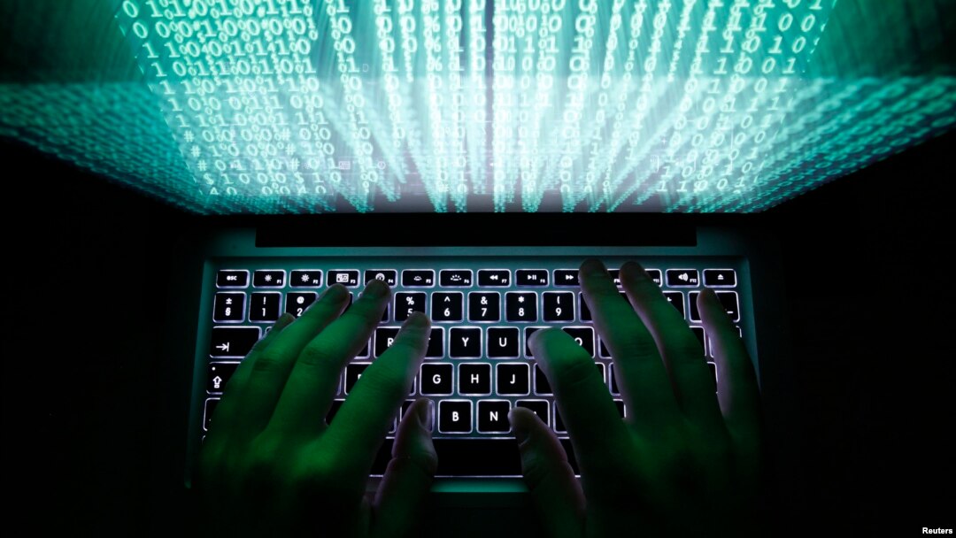 An illustration picture shows a man using a computer keyboard to enter data in Warsaw, Poland.