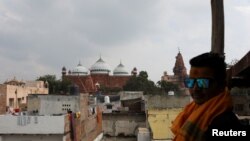 The Shahi Eidgah mosque and the Hindu temple are seen side-by-side in Mathura town, in the northern state of Uttar Pradesh, India, Jan. 24, 2022. 