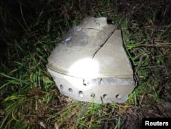 The debris, which the locals claim to be that of a missile, is pictured at the site of an explosion in Przewodow, a village in eastern Poland near the border with Ukraine, Nov. 16, 2022.