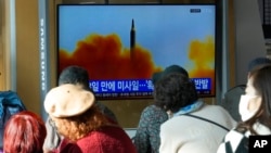 A TV screen shows a file image of North Korea's missile launch during a news program at the Seoul Railway Station in Seoul, South Korea, Nov. 17, 2022.