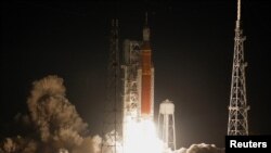 NASA's next-generation moon rocket, the Space Launch System (SLS) rocket with the Orion crew capsule, lifts off from launch complex 39-B on the unmanned Artemis 1 mission to the moon at Cape Canaveral, Florida, U.S. November 16, 2022.