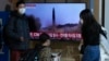 A TV screen shows a file image of North Korea's missile launch during a news program at the Seoul Railway Station in Seoul, South Korea, Nov. 18, 2022. 