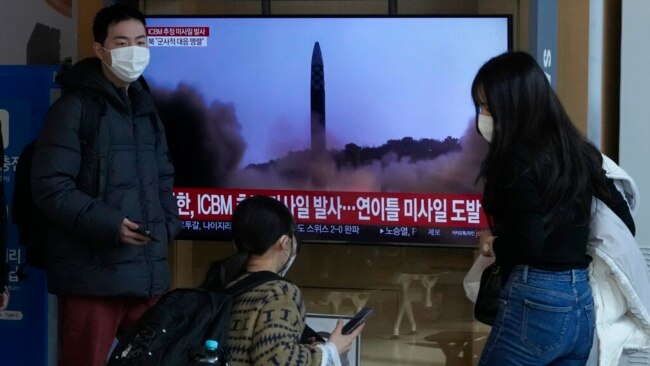 A TV screen shows a file image of North Korea's missile launch during a news program at the Seoul Railway Station in Seoul, South Korea, Nov. 18, 2022.