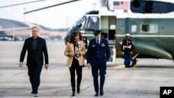 Vice President Kamala Harris and her husband, Doug Emhoff, arrive to board a plane to depart Andrews Air Force Base, Maryland., Nov. 16, 2022, en route to Thailand for the Asia-Pacific Economic Cooperation Summit.