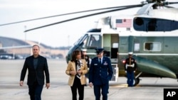 Vice President Kamala Harris and her husband, Doug Emhoff, arrive to board a plane to depart Andrews Air Force Base, Md., Nov. 16, 2022, en route to Thailand for the Asia-Pacific Economic Cooperation Summit.