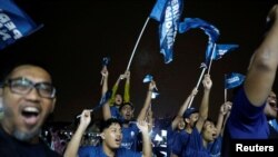 Supporters of Malaysia's Perikatan Nasional coalition react during a campaign event ahead of elections, at Ulu Klang, Selangor, Malaysia, Nov. 14, 2022.