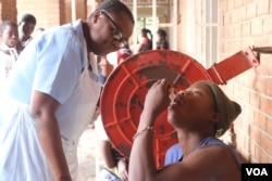 Medical workers in Malawi say cholera vaccine intake has been slow because many people fear it will cause infertility. (Lameck Masina/VOA)