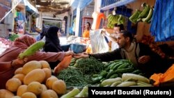 FILE: A woman shops in a photo illustration at vegetable market in Casablanca, Morocco. Taken Jun. 29, 2017. 