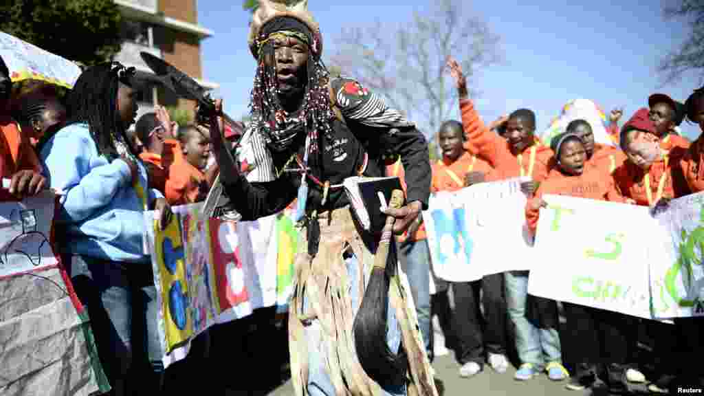 Wellwishers sing and dance in support of ailing former South African President Nelson Mandela.